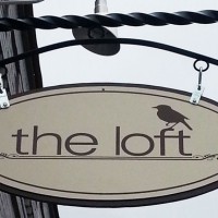 Oval Hanging Sign looks great with the right black wrought iron hanging bracket