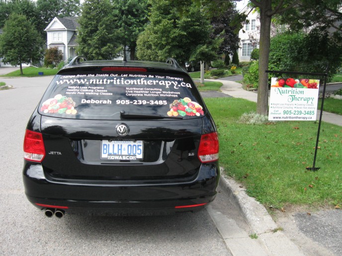 This little car looks stunning with white vinyl lettering and digital images... her stake sign was done to match vehicle and is great advertising for a home based business!
