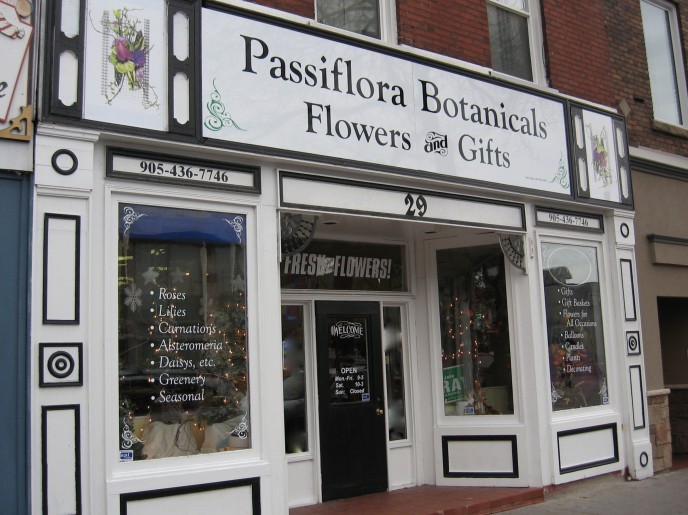 Digital Images, Vinyl, Paint, Aluminum, Window Letterign were all used to create this complete detailed storefront. Their vehicles were done to match - stunning!